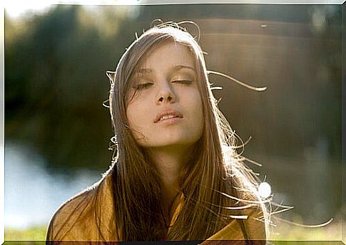 Woman with closed eyes trying to manage emotions