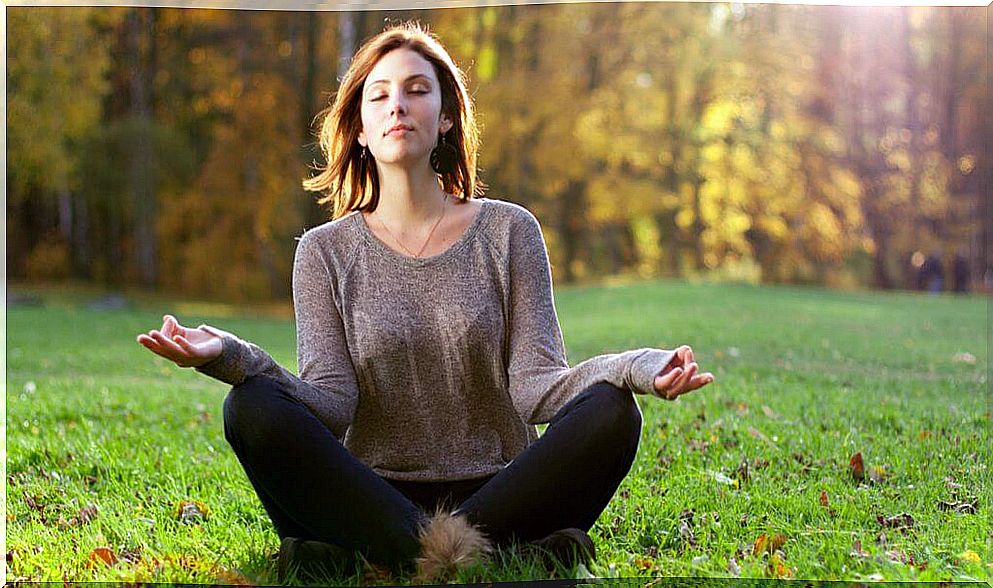 Woman meditating in a meditation retreat