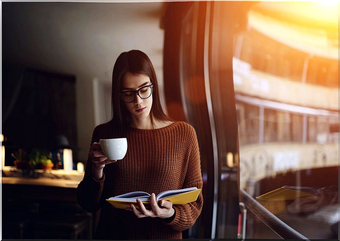 Woman reading standing