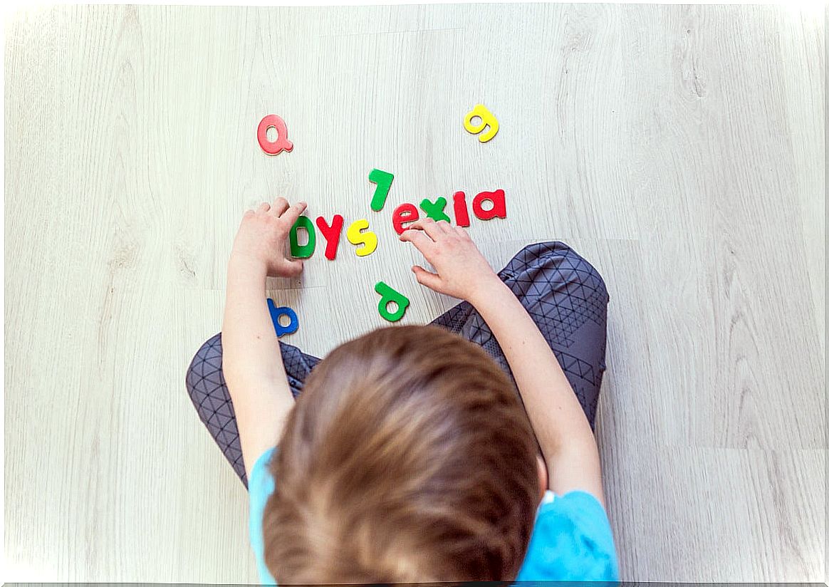 Boy forming the word dyslexia