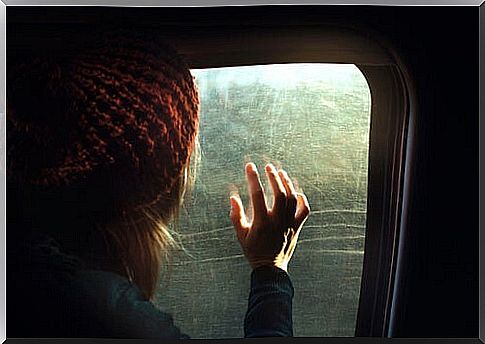 Woman looking out the window