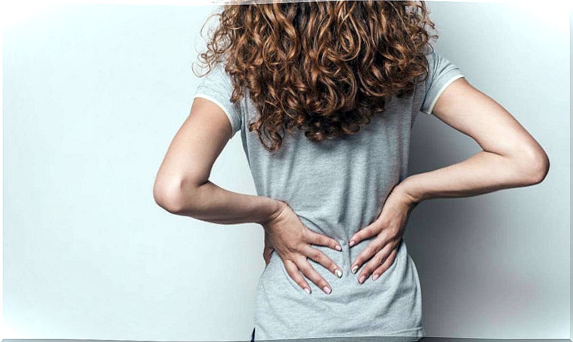 woman suffering back pain from anxiety