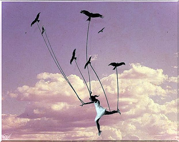 Flying girl held on by ropes by birds