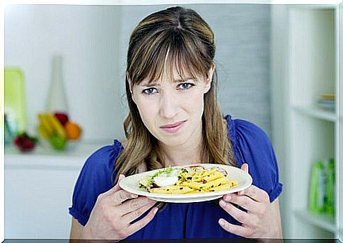 Woman experiencing disgust for food