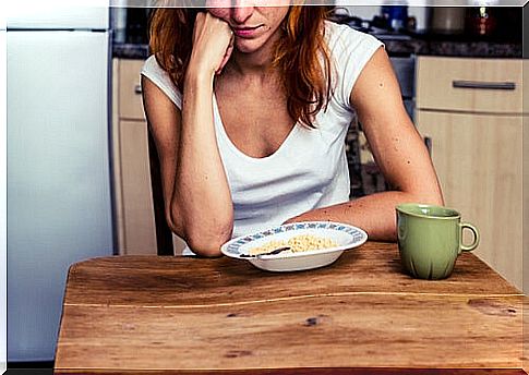 Bored woman eating