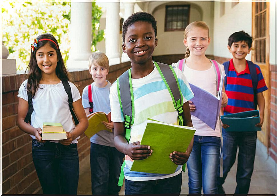 Happy children leaving class