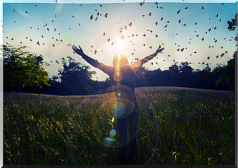 Woman with open arms enjoying her happiness