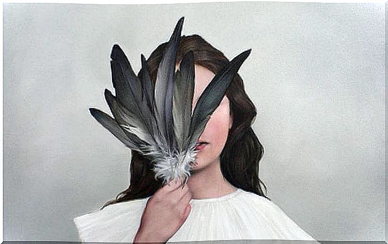 girl covering her face with feathers representing high sensitivity