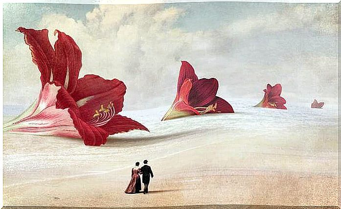 couple walking in front of giant flowers