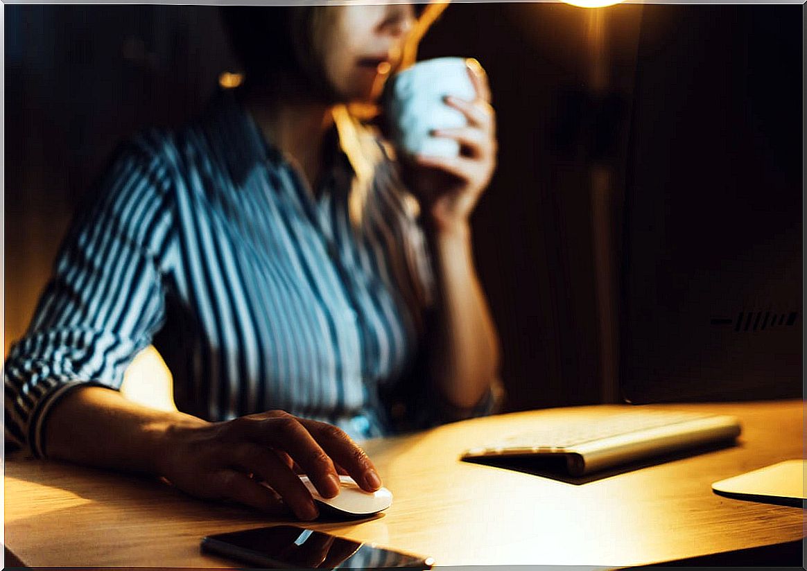 Woman working in her office at night