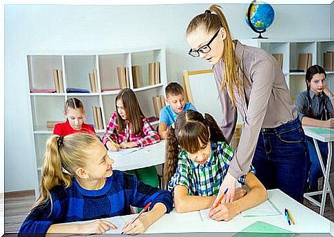 Children in the process of learning with their teacher