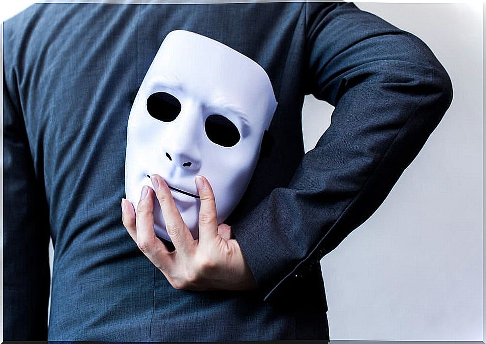 Man with mask behind his back