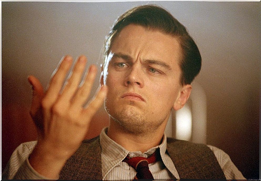 Leonardo DiCaprio looking at his hand