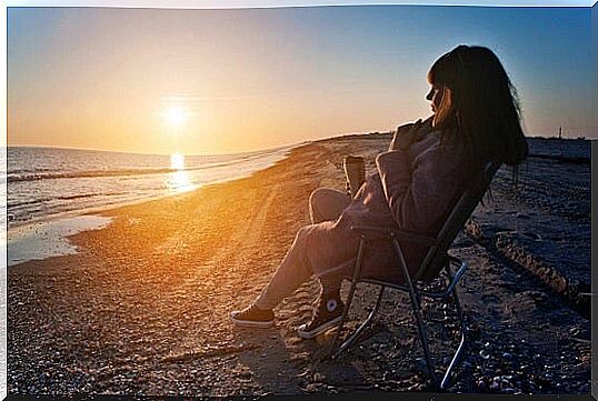 girl on the beach thinking about putting distance