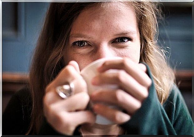 Woman drinking a hot tea