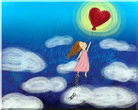 Little girl flying with a heart balloon in her hand