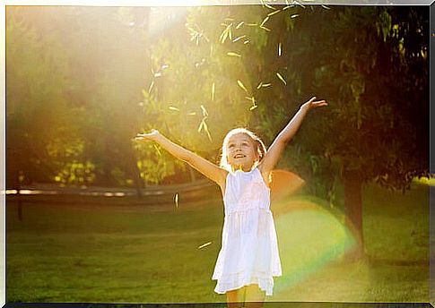 Little girl enjoying in the field