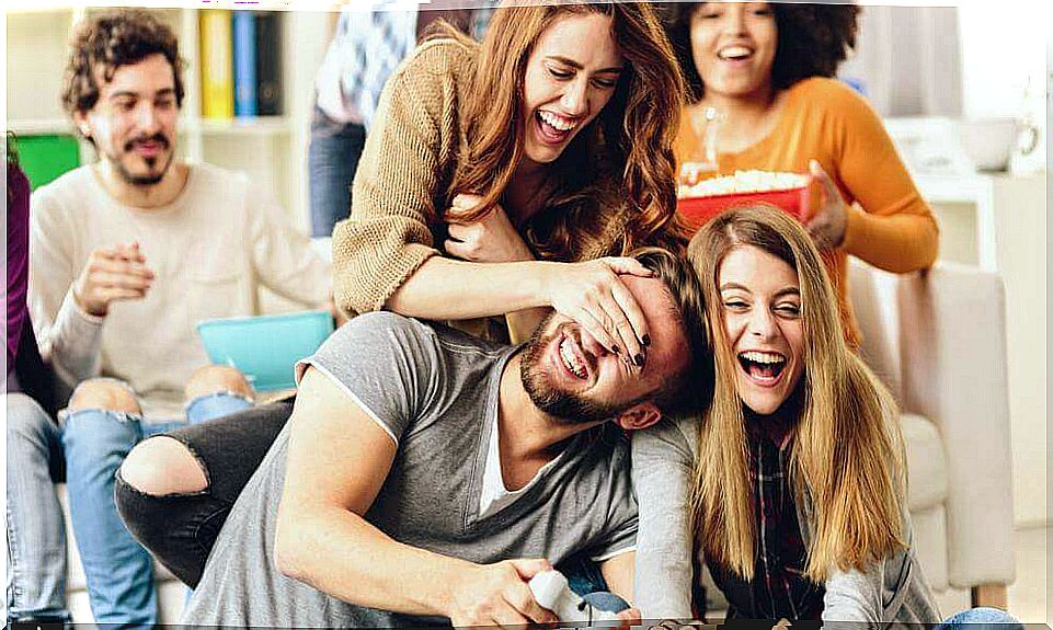 Friends having fun while eating popcorn