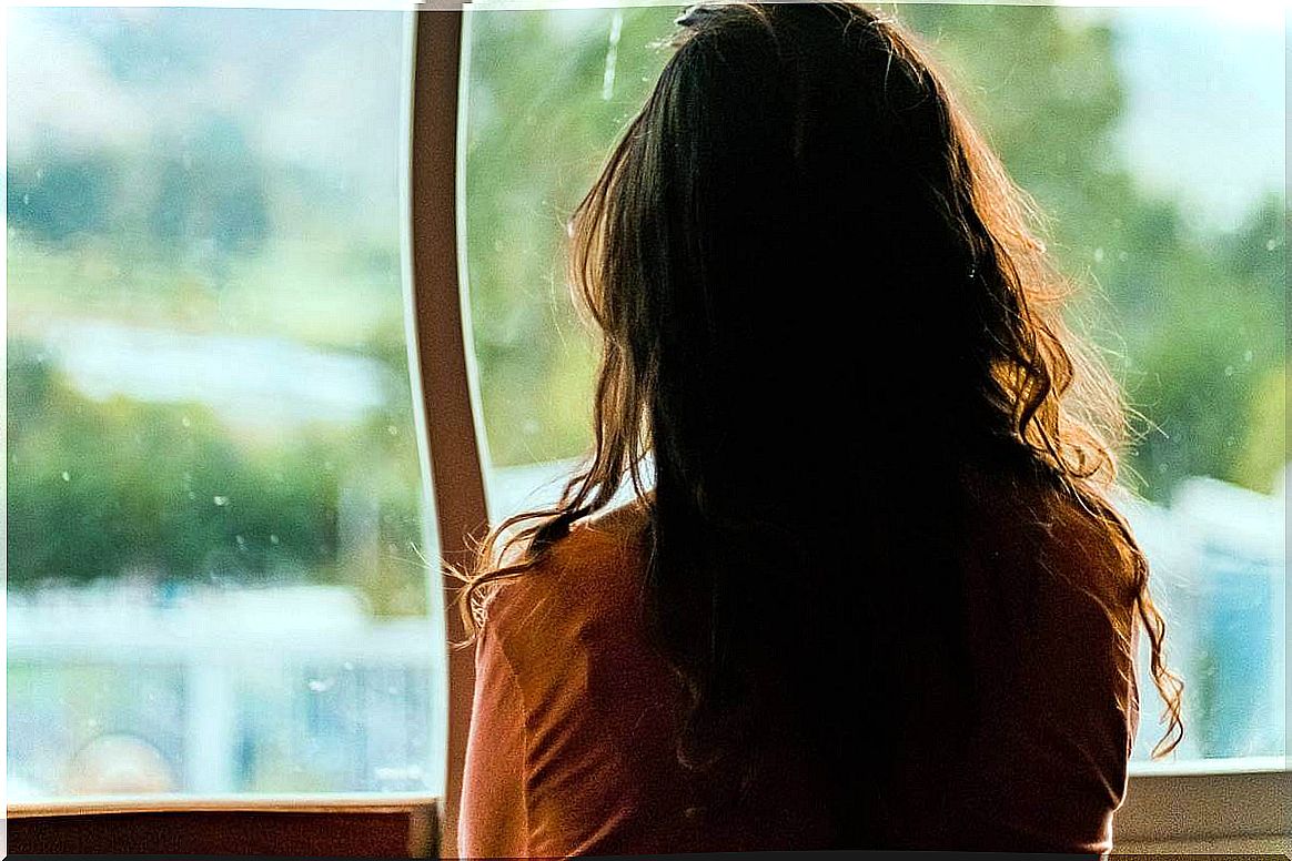 Woman in front of a window