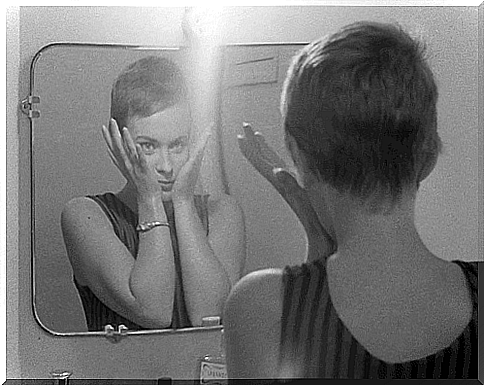 Woman looking in the mirror