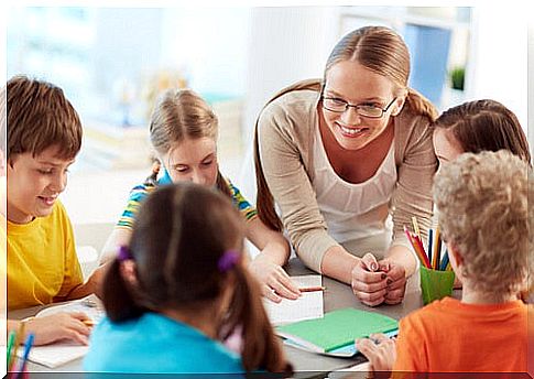 Teacher with students at school