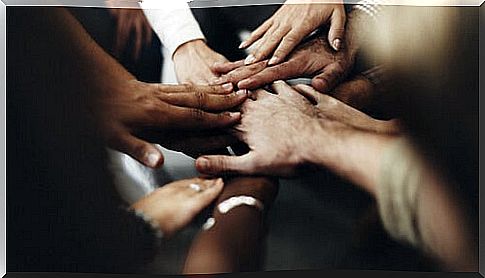 United hands of many people representing the representing the value of coexistence 