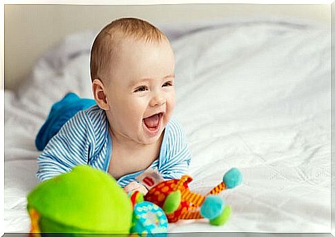 Baby smiling while playing