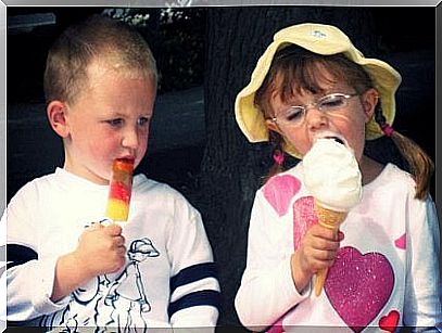 Boy being envious of a girl for her ice cream