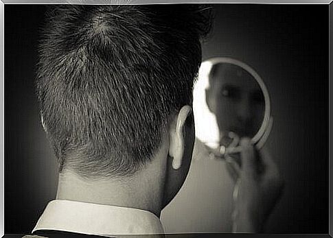 Man looking in a mirror