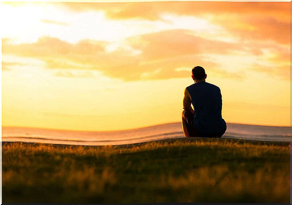 Lonely man looking at the horizon thinking about when family does not help 