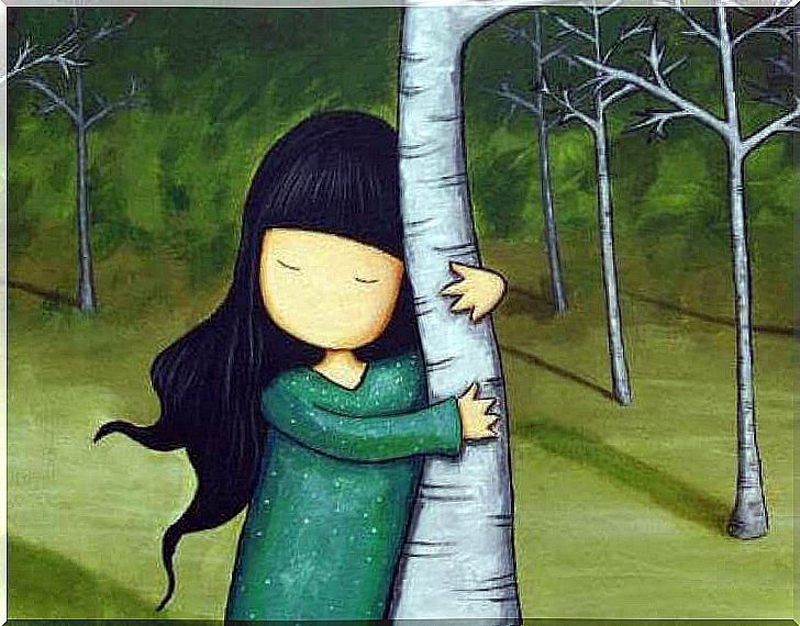 Girl clinging to a tree