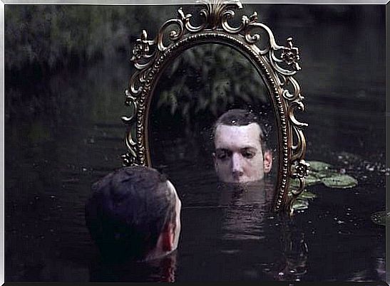 man in front of mirror thinking about recovery